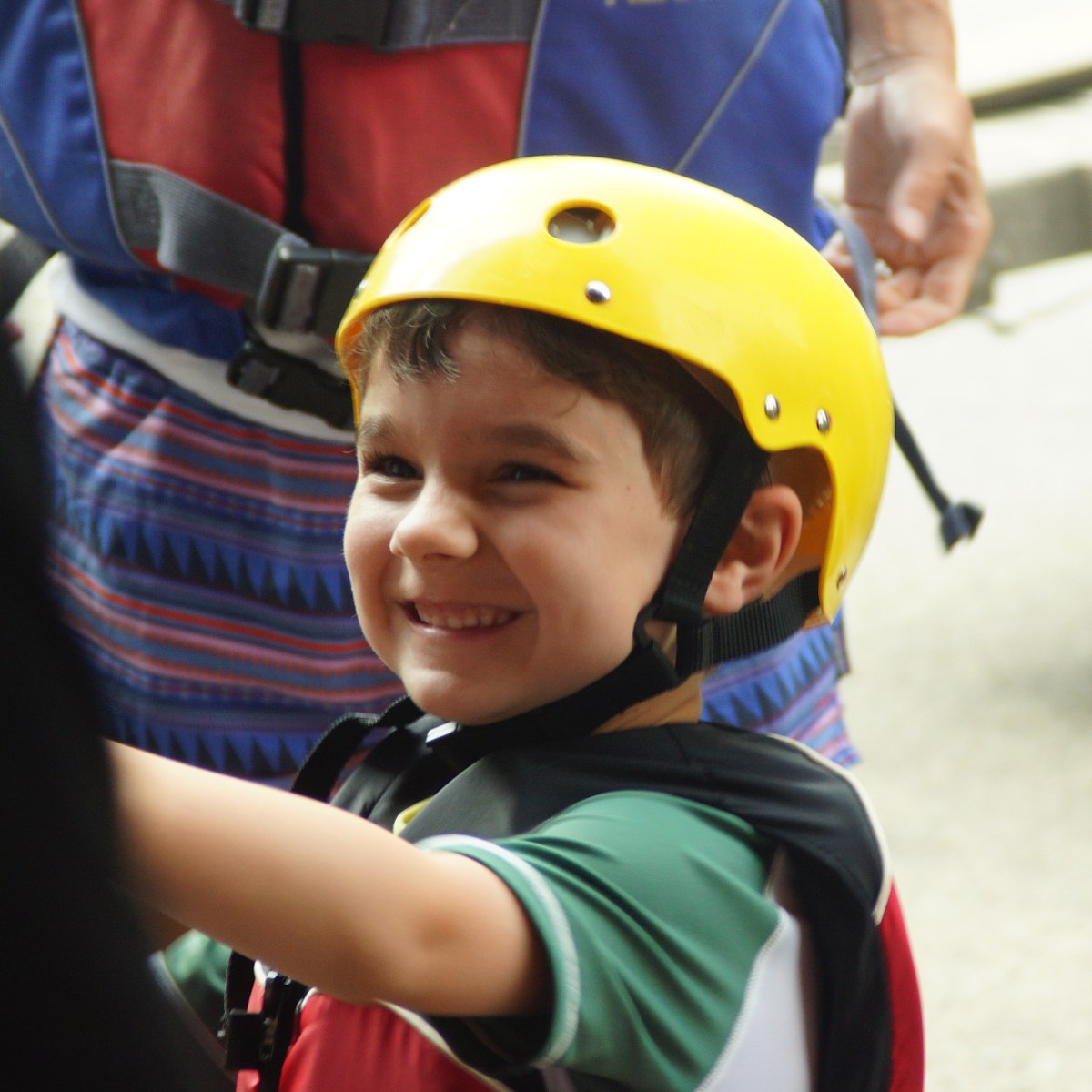 a little boy wearing a helmet