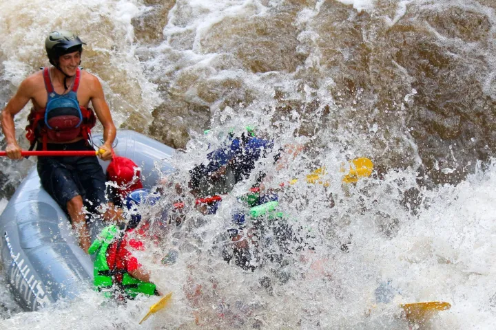 a man in a raft on the water