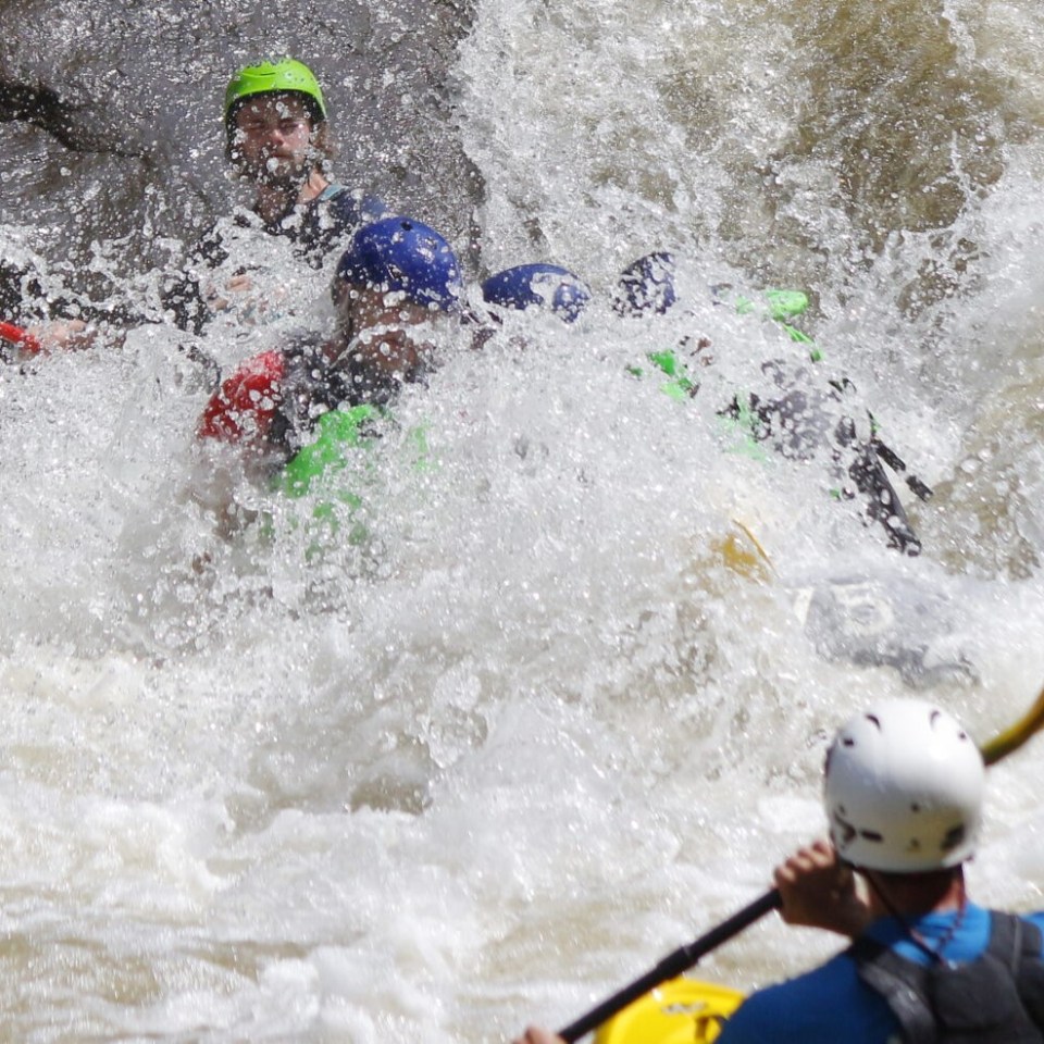 a young man riding a wave on a surfboard in the water
