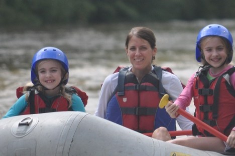 Mother and daughters enjoying a rafting trip