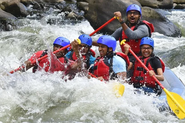 a group of people riding skis on a raft in a body of water
