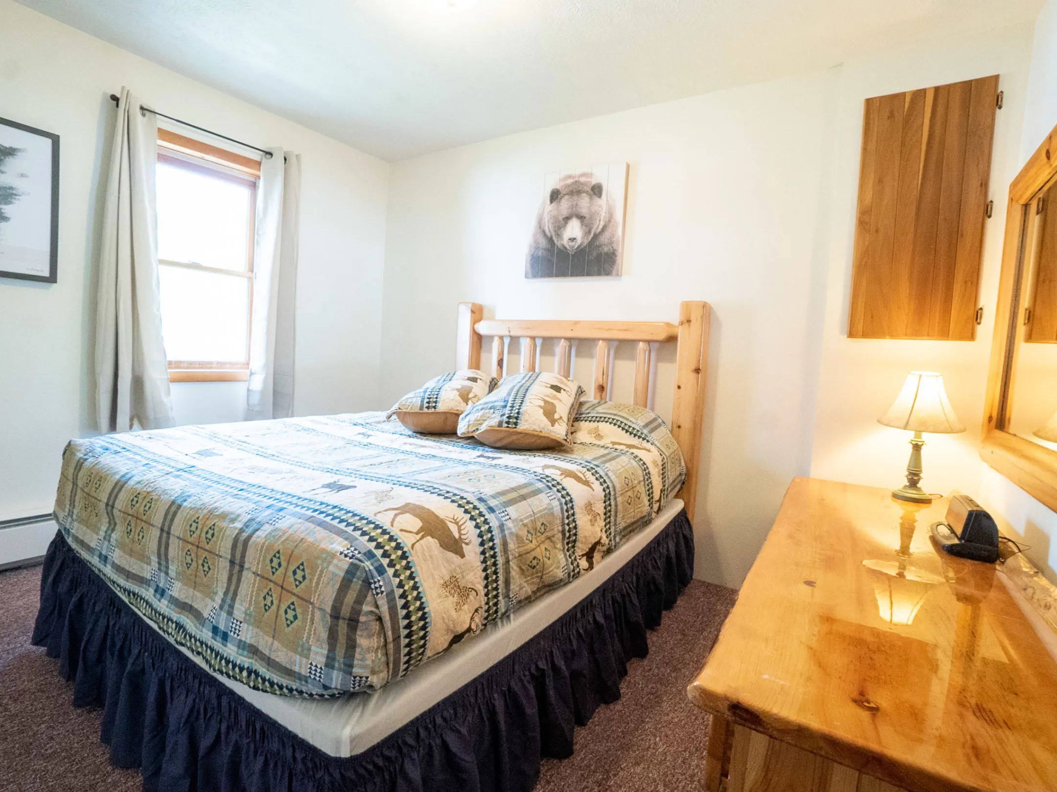 a bedroom with a bed in a hotel room