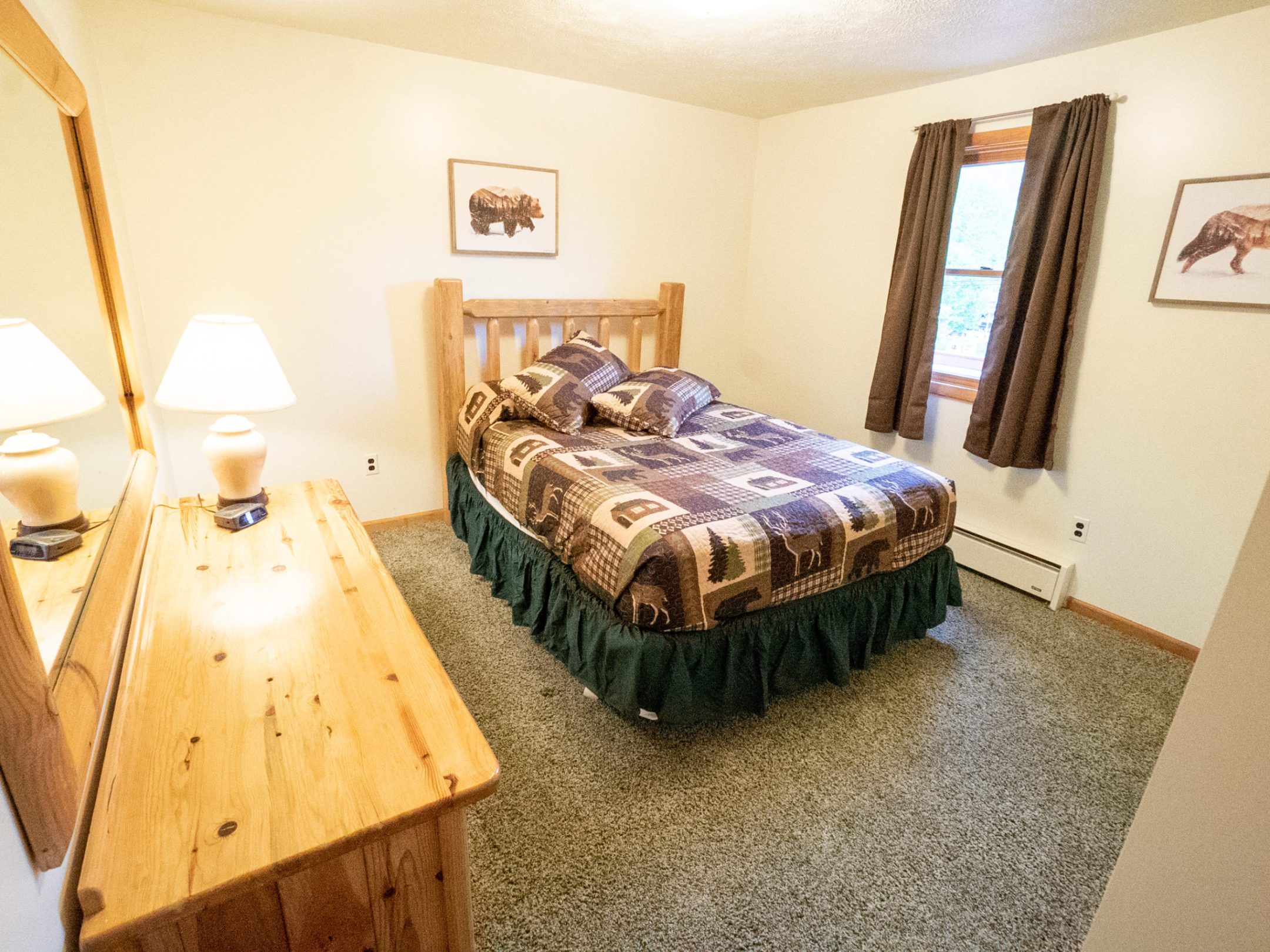 a bedroom with a bed in a room