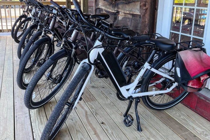 a bicycle parked in front of a brick building