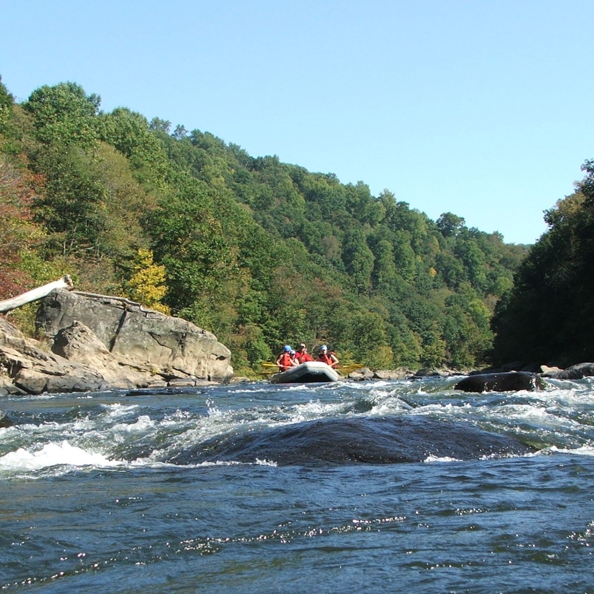 a body of water with a mountain in the background