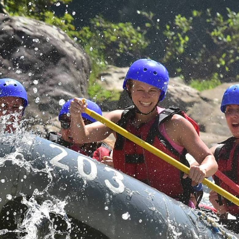 a young child riding on a raft