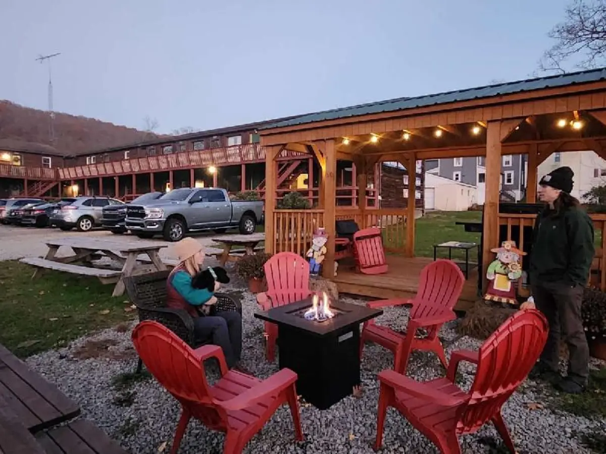 a group of people sitting at a picnic table
