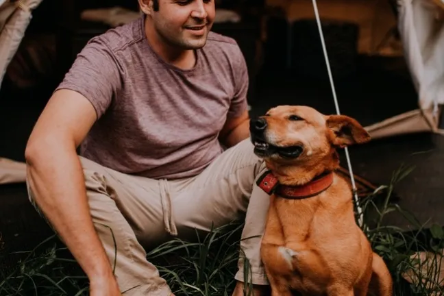 a person holding a dog